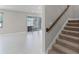 View of the living room with carpeted stairs leading to the second floor at 10249 Spring Lake Dr, Clermont, FL 34711