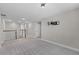Cozy upstairs living area with carpet flooring and neutral walls at 10249 Spring Lake Dr, Clermont, FL 34711