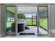 Covered patio features a relaxing hot tub and peaceful views of the yard at 10249 Spring Lake Dr, Clermont, FL 34711