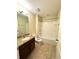 Cozy bathroom featuring a granite vanity, and a shower-tub combination with tile flooring at 10506 Green Ivy Lane, Orlando, FL 32832