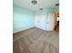Bedroom with bright blue walls, carpet flooring and a double door closet at 10506 Green Ivy Lane, Orlando, FL 32832