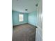 Bedroom with bright blue walls, carpet flooring and natural light at 10506 Green Ivy Lane, Orlando, FL 32832