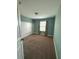 Bedroom with bright blue walls, carpet flooring, and natural light at 10506 Green Ivy Lane, Orlando, FL 32832
