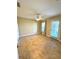 Bright and airy bedroom featuring neutral walls, tiled floors, a ceiling fan, and a glass door to the outside at 10506 Green Ivy Lane, Orlando, FL 32832