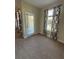 A well-lit bonus room with neutral carpet, offering a versatile living space at 10506 Green Ivy Lane, Orlando, FL 32832