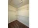 Walk-in closet with wire shelving providing ample storage space in this home at 10506 Green Ivy Lane, Orlando, FL 32832