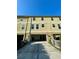 Townhome exterior with a two car garage and a private driveway at 10506 Green Ivy Lane, Orlando, FL 32832