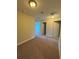 Hallway featuring neutral colored walls and carpeted floor leading to multiple rooms at 10506 Green Ivy Lane, Orlando, FL 32832