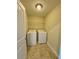 Bright laundry room with tile flooring and side-by-side washer and dryer at 10506 Green Ivy Lane, Orlando, FL 32832