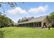 Expansive backyard with a screened-in patio and ample green space at 10664 Spring Buck Trl, Orlando, FL 32825