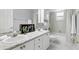 Well-maintained bathroom with double sinks, modern fixtures, and a shower-tub combination at 10664 Spring Buck Trl, Orlando, FL 32825
