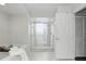 Clean bathroom showcasing a glass-enclosed shower and a soaking tub at 10664 Spring Buck Trl, Orlando, FL 32825