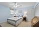 Charming blue bedroom with a quilt, window, and closet at 10664 Spring Buck Trl, Orlando, FL 32825
