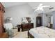 Cozy bedroom featuring vaulted ceilings, a ceiling fan, and ample natural light at 10664 Spring Buck Trl, Orlando, FL 32825