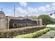 The Cypress Springs II community entrance featuring well-manicured landscaping and a brick sign at 10664 Spring Buck Trl, Orlando, FL 32825