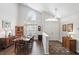 Bright dining room featuring high ceilings, chandelier, and a large window providing ample natural light at 10664 Spring Buck Trl, Orlando, FL 32825