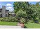 Charming garden features brick walkway, an iron gate, and colorful flowers at 10664 Spring Buck Trl, Orlando, FL 32825