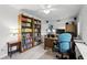 Bright home office space with wooden bookshelves and a comfortable workspace at 10664 Spring Buck Trl, Orlando, FL 32825