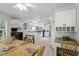 Open-concept kitchen area with a breakfast nook and seamless flow to the adjacent dining space at 10664 Spring Buck Trl, Orlando, FL 32825