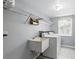 Well-equipped laundry room with a utility sink, modern washer, and dryer, offering convenience and functionality at 10664 Spring Buck Trl, Orlando, FL 32825