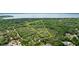 Scenic aerial shot of large wooded lot close to a beautiful body of water at 1090 Braddock Rd, Deltona, FL 32725
