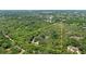 Expansive aerial view of a lush, wooded lot with a defined property line at 1090 Braddock Rd, Deltona, FL 32725
