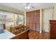 Bedroom features a large window, desk, and ample closet space providing a bright and functional area at 1090 Braddock Rd, Deltona, FL 32725