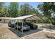Spacious metal carport with three vehicles parked beneath, providing covered parking at 1090 Braddock Rd, Deltona, FL 32725