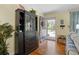 Welcoming entryway featuring hardwood floors, elegant furniture, and a view of the outdoors at 1090 Braddock Rd, Deltona, FL 32725