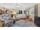 Bright and airy living room featuring hardwood floors, comfortable seating, and an open layout at 1090 Braddock Rd, Deltona, FL 32725