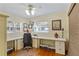 Bright home office with built-in desk, drawers, baskets, wood floor, and natural light at 1090 Braddock Rd, Deltona, FL 32725