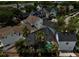 Overhead view of a house with a screened-in pool, palm trees, and lush landscaping at 1101 Rush Ct, Celebration, FL 34747