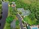 Lovely aerial view of the recreational area, featuring tennis courts, basketball court, swimming pool, and lush landscaping at 1101 Rush Ct, Celebration, FL 34747