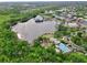 Breathtaking aerial view of a lakefront community with lush greenery and stunning architecture at 1101 Rush Ct, Celebration, FL 34747