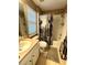 Cozy bathroom with tiled floors and shower with patterned curtain at 1101 Rush Ct, Celebration, FL 34747