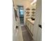 Bathroom featuring double sinks, decorative shelves, and stylish rugs at 1101 Rush Ct, Celebration, FL 34747