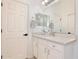 Bathroom vanity features quartz countertops, storage and a large mirror at 1101 Rush Ct, Celebration, FL 34747