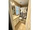 Cozy bathroom with tiled floors and shower with patterned curtain at 1101 Rush Ct, Celebration, FL 34747