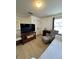 This bedroom has a sitting area, a TV, and neutral tones, perfect for relaxation and entertainment at 1101 Rush Ct, Celebration, FL 34747