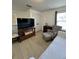 A bedroom featuring a tv, armchair, and lots of light at 1101 Rush Ct, Celebration, FL 34747