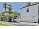 Exterior of home with white siding, garage, a well manicured lawn, and a screened-in patio at 1101 Rush Ct, Celebration, FL 34747