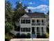 Charming two-story home with a welcoming front porch and beautifully manicured landscaping at 1101 Rush Ct, Celebration, FL 34747