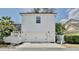 Detached two-car garage with white exterior, offering additional parking and storage space at 1101 Rush Ct, Celebration, FL 34747