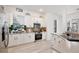 Well-lit kitchen with white cabinetry, stainless steel appliances, and a decorative backsplash, creating a modern space at 1101 Rush Ct, Celebration, FL 34747