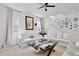 Spacious living room features an open staircase and ample seating with comfortable sofas at 1101 Rush Ct, Celebration, FL 34747