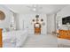 Large main bedroom is bright and airy with wood floors, neutral colors, and good light at 1101 Rush Ct, Celebration, FL 34747