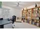Bright office space with bookshelves displaying collectibles, desk, and a comfortable chair at 1101 Rush Ct, Celebration, FL 34747
