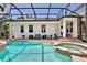 The beautiful pool and spa are surrounded by comfortable outdoor seating on a brick-paved patio at 1101 Rush Ct, Celebration, FL 34747