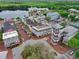 Charming aerial view of the town center featuring picturesque buildings, tree-lined streets, and vibrant atmosphere at 1101 Rush Ct, Celebration, FL 34747