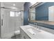 Updated bathroom with marble vanity, shower, and chrome fixtures at 1140 S Orlando Ave # E11, Maitland, FL 32751
